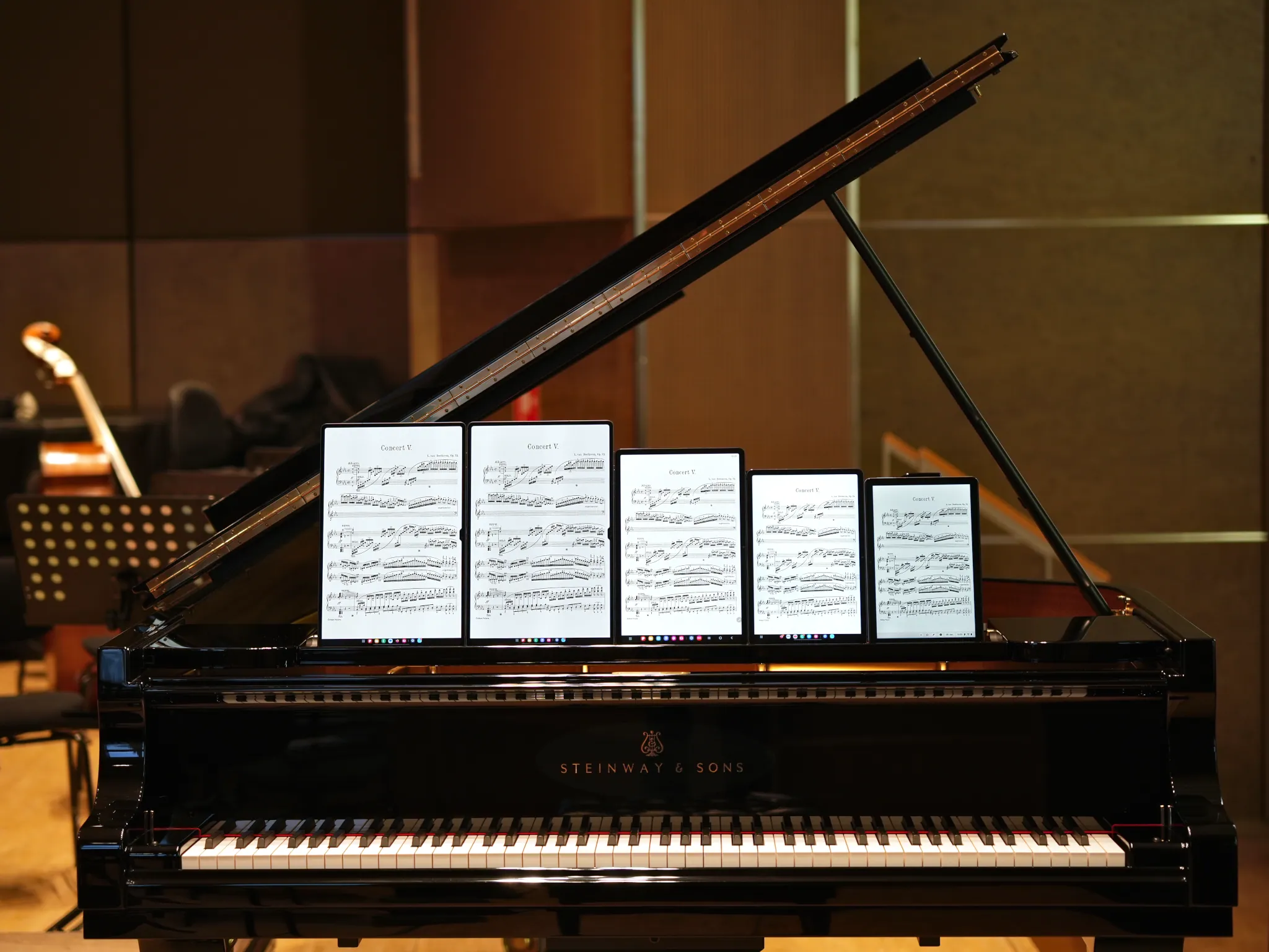 Tablets for musicians – Tablets with piano sheet music on a Steinway grand piano