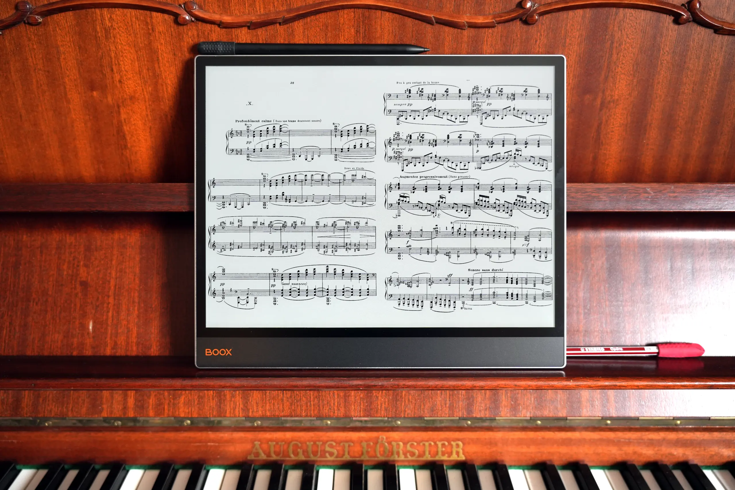 Onyx BOOX Tab X C Color on a piano with sheet music - The best e-reader for musicians